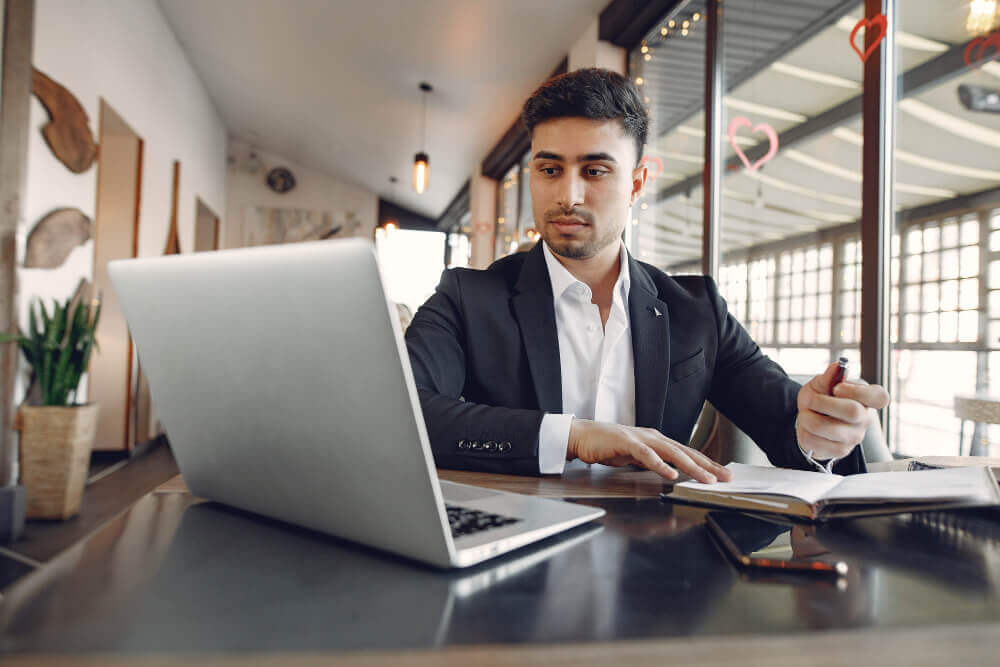 asian-businessman-working-on-laptop